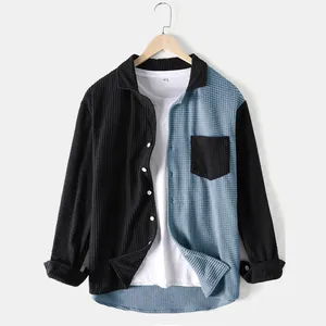 Close-up of a men's color-block corduroy shirt with unique black and blue paneling