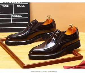 Detail view of brown genuine leather men's derby shoes with thick platform soles