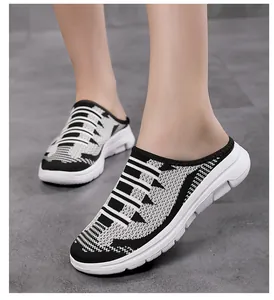 Detailed side view of black and white flyknit mesh breathable mules shoes