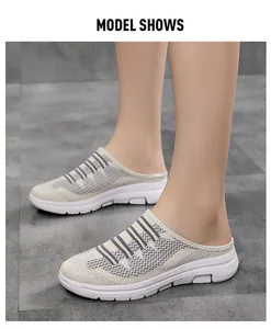Close-up view of breathable fly-knit mesh mule sneakers for women shown on a model