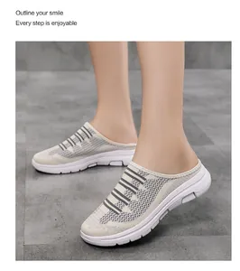 Close-up of breathable fly-knit mesh mule sneakers for women on model feet