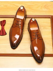 Detail of brown glossy leather derby shoes with thick soles and pointed toe design