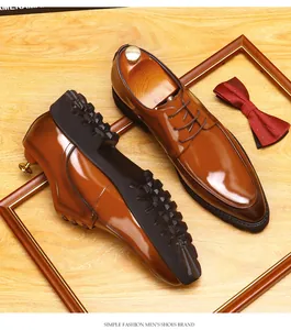 Detail view of brown leather Derby shoes with thick soles and red bow tie accessory
