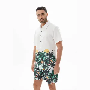 Detailed view of men's two-piece Hawaiian set with tropical palm tree print on white background.