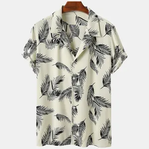 Detailed macro view of men's cream Hawaiian shirt featuring black palm leaf prints