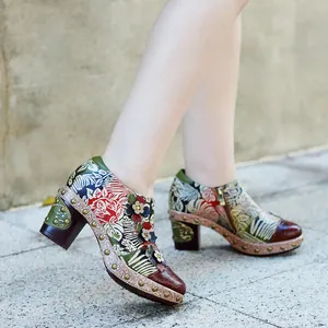 Side view of vintage floral leather heels with 3D flower appliques and block heel