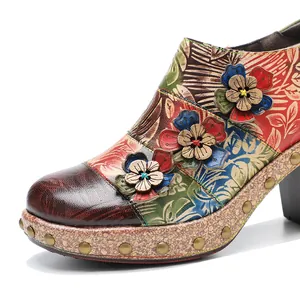 Detailed macro view of vintage floral genuine leather shoe with 3D flower and stud accents
