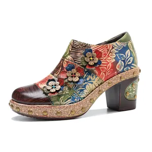 Detailed side view of retro floral embossed leather chunky heel shoes with 3D flowers
