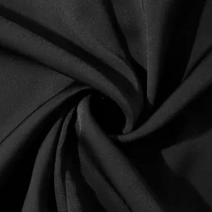 High-quality detailed close-up of black smooth drape fabric texture for men's shirt