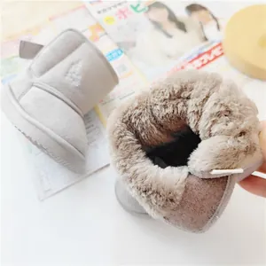 Detailed view of the thick warm faux fur lining of children's winter snow boots