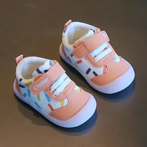 Detailed view of breathable leather baby walking shoes with colorful dot patterns