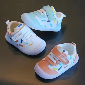 Close-up of baby walking shoes showing three color variants with sprinkle patterns