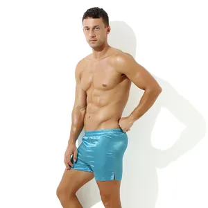 Detailed view of men's blue satin lounge shorts with side slit and elastic waist.