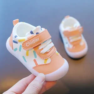 Macro view of peach baby toddler shoes featuring colorful sprinkles and Chidier strap logo