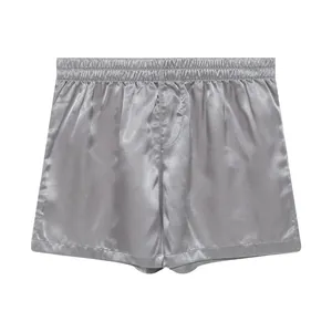 Detailed view of silver satin men's house shorts featuring a smooth, glossy finish