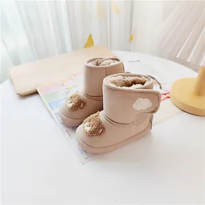 Cozy children's snow boots featuring a cute bear design and warm plush lining for winter