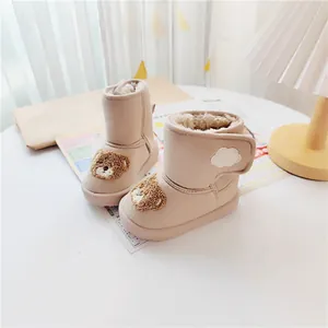 Cute beige kids snow boots with cartoon bear and warm faux fur lining details.