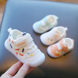 Detailed shot of breathable leather baby walking shoes featuring soft non-slip soles