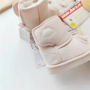 Detail of pink futafuta toddler snow boots featuring thick warm faux fur lining