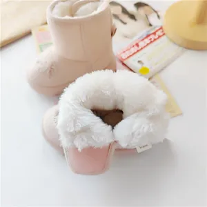 Cozy baby winter snow boots with thick white plush lining and adjustable hook-and-loop closure