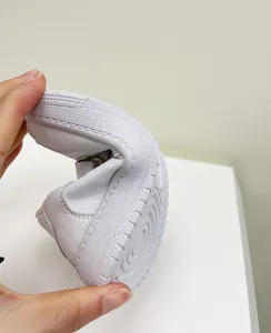 Flexible white toddler sneakers with soft sole for baby boys' walking support and comfort