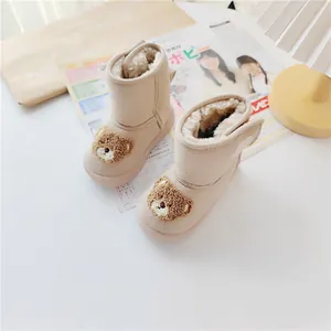 Cozy beige toddler snow boots with plush lining and cute teddy bear design for winter