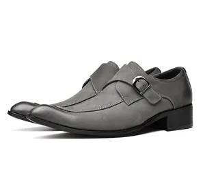 Detailed side view of grey suede monk strap dress shoes with elegant white stitching