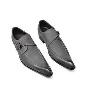 Detailed top view of grey leather monk strap dress shoes with pointed toes and buckles