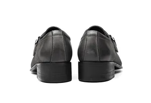 Rear view of grey leather monk strap dress shoes with white stitching detail.