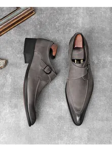 Top view of grey suede monk strap shoes with pointed toe and shoe trees