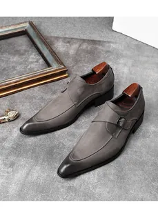 Detailed side view of grey suede leather Monk strap shoes with elegant pointed toe