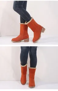Stylish orange suede mid-calf snow boots featuring a chunky block heel and soft faux fur lining.