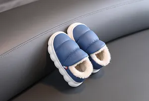 Detailed macro view of blue waterproof kids winter boots featuring a warm plush lining
