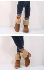 Detailed side and front view of brown suede ankle boots with soft faux shearling cuff