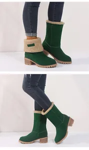 Detailed view of women's forest green mid-calf snow boots with a chunky heel and faux fur