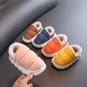 Cozy waterproof children's winter slippers with plush lining and puffy quilted design.