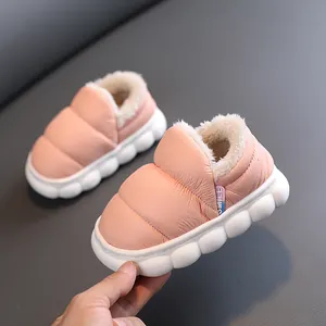 Pink children's winter snow boots with warm fleece lining and thick non-slip soles