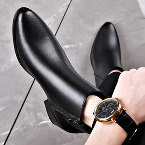 Elegant black genuine leather Chelsea boots for men with side zipper and pointed toe.