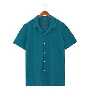 Detail view of men's waffle knit short sleeve shirt with lapel collar and pocket