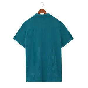 Detailed back view of men's teal waffle knit short sleeve shirt with minimalist design