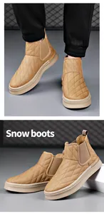 Detailed view of quilted tan leather Chelsea snow boots with side elastic panels