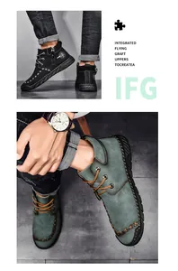Close-up of men's mid-top work boots with side zipper and contrast stitching