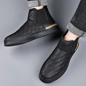 Men's stylish black quilted Chelsea boots with thick soles and classic British design.