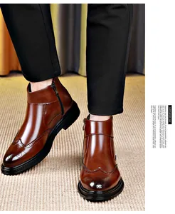 Detail view of brown men's brogue boots with side zipper and wingtip detailing