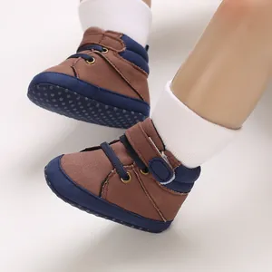 Detail of brown and blue high-top baby walking shoes with soft non-slip soles