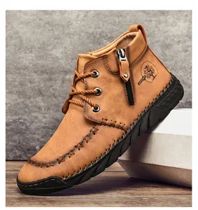 Close-up of men's tan leather Martin boot with side zipper and hand-stitched detailing.