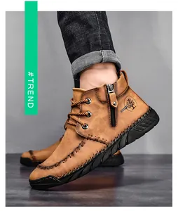 Close-up of brown men's mid-top Martin boots with side zipper and rugged sole