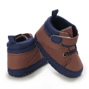 Detail view of brown canvas baby walker shoes with soft soles and velcro straps