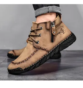Side detail of men's brown mid-top Martin boots featuring side zipper and logo