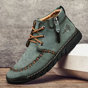 Men's mid-top work boots in teal nubuck leather with side zipper and non-slip sole